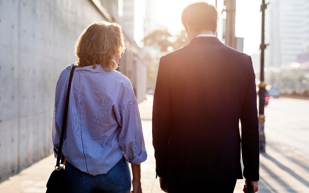 Couple walking and discussing Hannah's Law as protection against coercive control